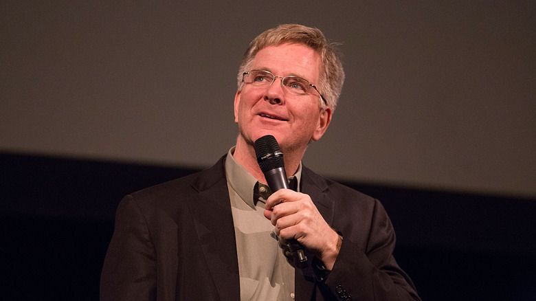 Rick Steves speaking on stage