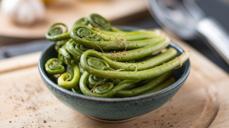 A bowl containing fiddlehead ferns