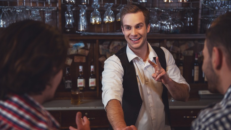 bartender taking order for drinks