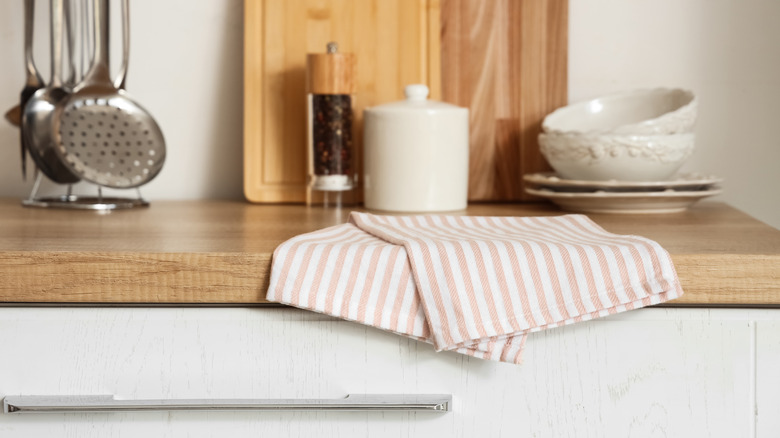 A towel sits on a kitchen counter.
