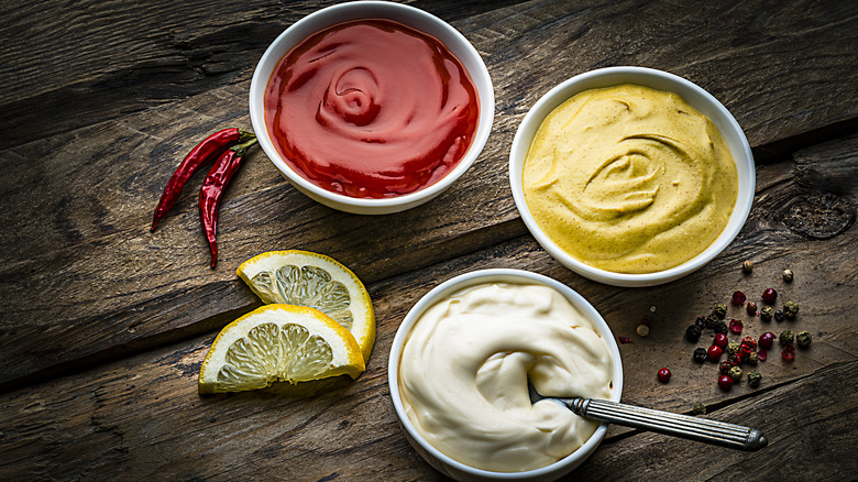 Various condiments in small bowls
