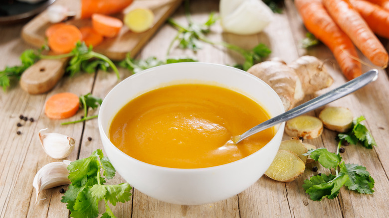 A bowl of creamy vegetable soup.