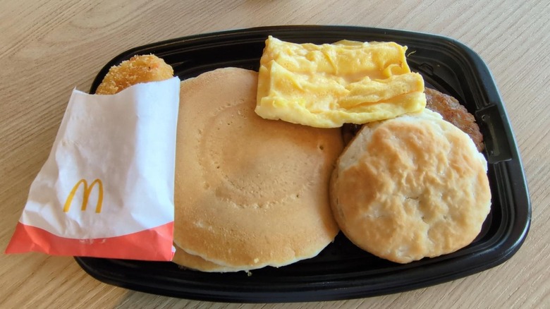 A McDonald's breakfast platter sits on a table.
