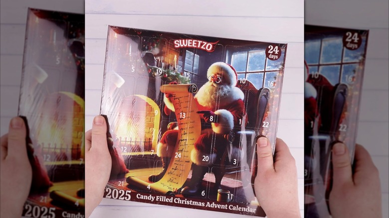Hands hold up a Sweetzo Christmas Candy Advent Calendar