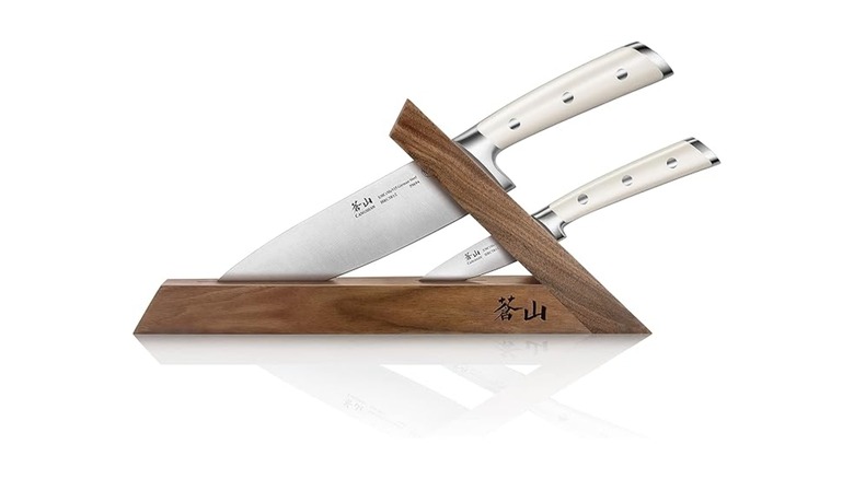 Two Cangshan knives in a walnut block