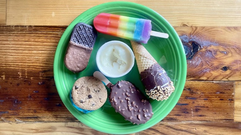 Overhead view of various frozen desserts from Costco on a green plate