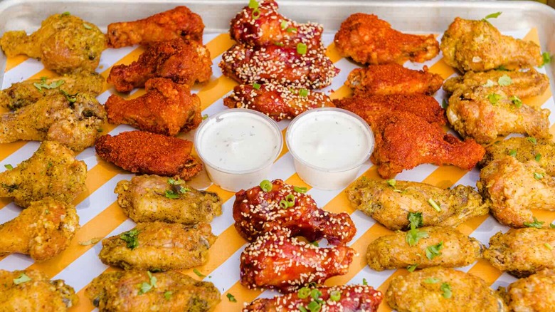 Selection of Starbird Chicken wings resting on a yellow striped tray