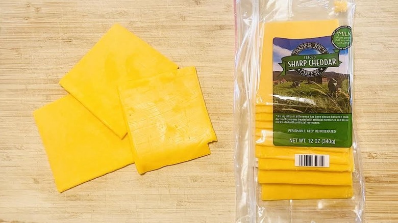 Sliced Trader Joe's Sharp Cheddar Cheese with packaging