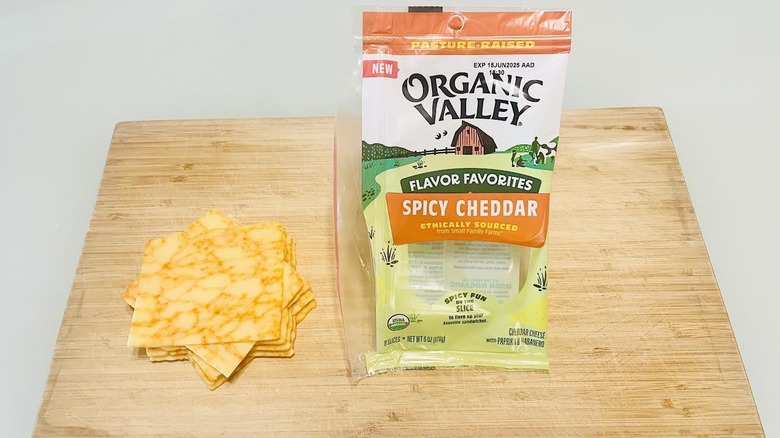 Slices of Organic Valley Spicy Cheddar Cheese with packaging