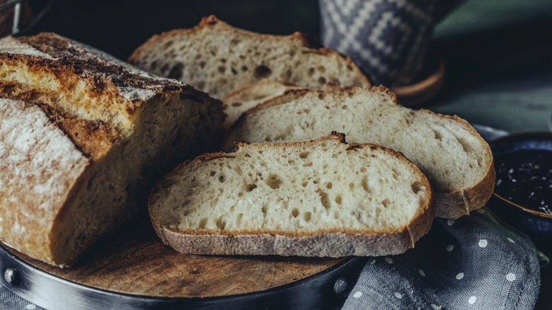 Loaf of country-style bread with slices
