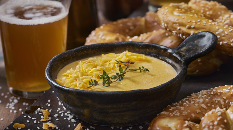 Beer cheese sauce with soft pretzels
