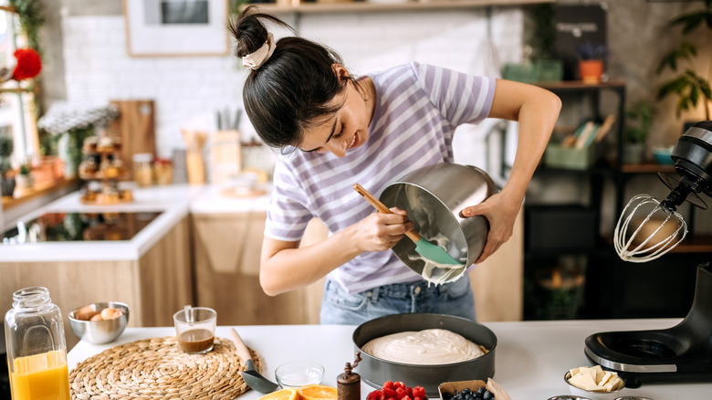 a woman preparing cake
