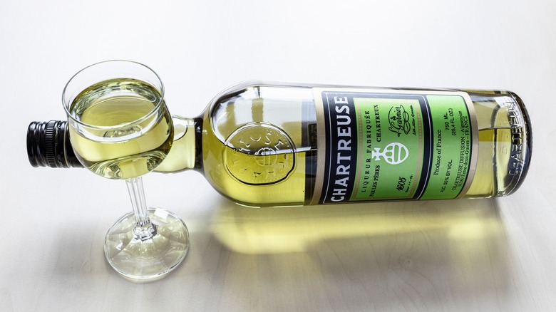 glass and bottle of Chartreuse