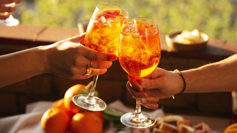 Cheers with Aperol Spritz
