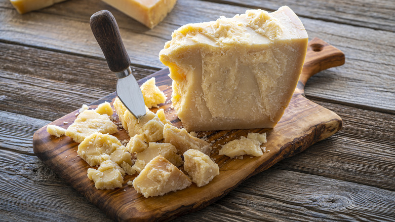 Wedge of Parmesan on cheese board 