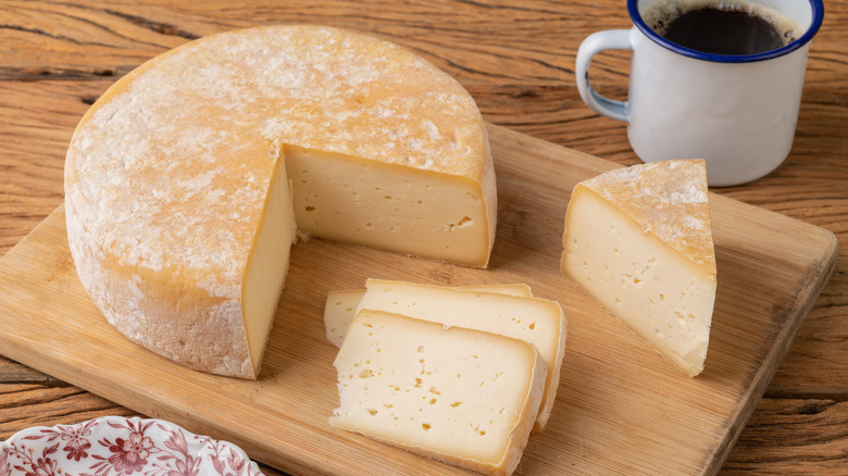 Wheel of cheese and coffee