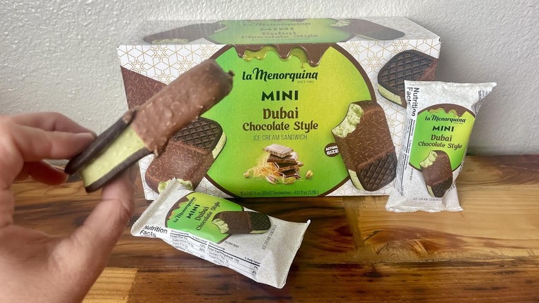 A box of mini Dubai chocolate bars held in hand.