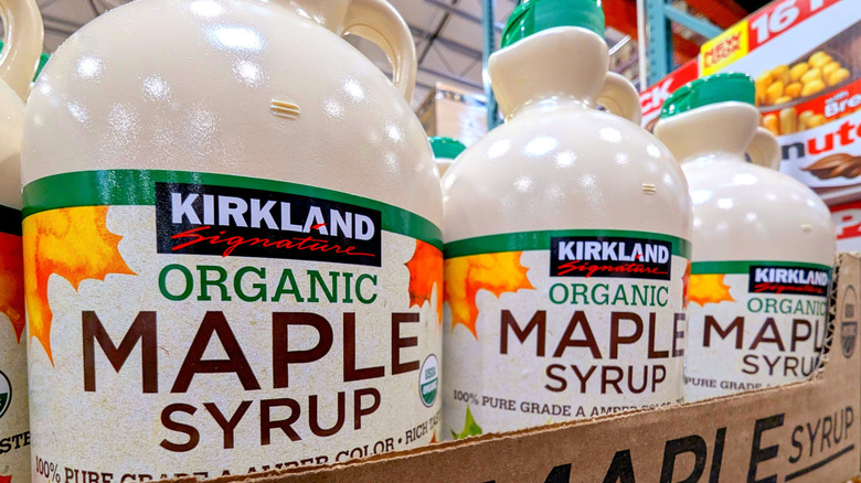 Cases of Kirkland Signature Organic Pure Maple Syrup inside Costco