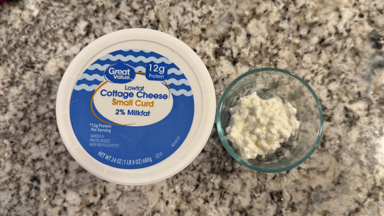 Overhead shot of Great Value's Lowfat Cottage Cheese with a ramekin of the cheese next to it