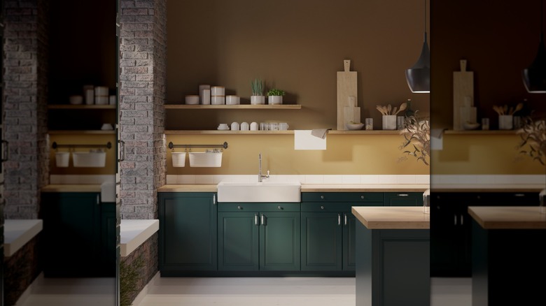 Moody green and gold kitchen