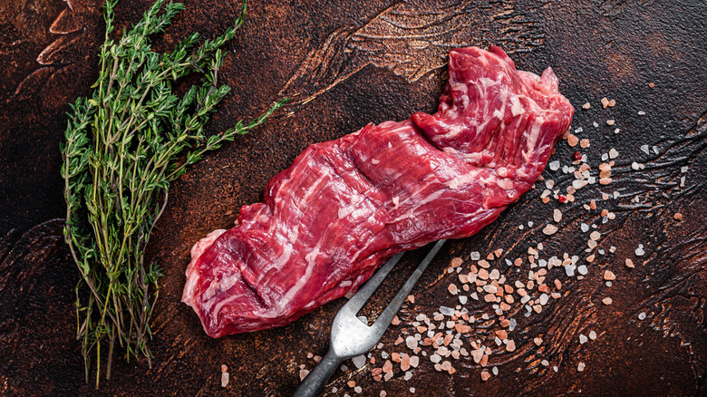 skirt steak on wooden board