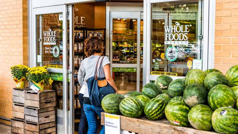 Woman entering Whole Foods