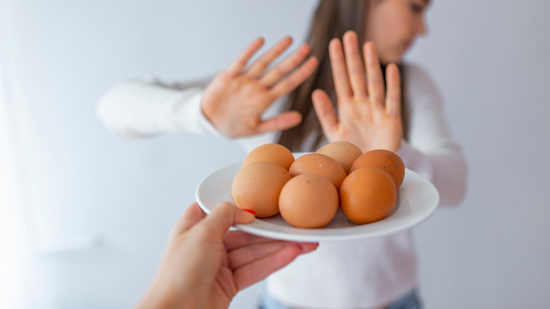 woman refusing eggs
