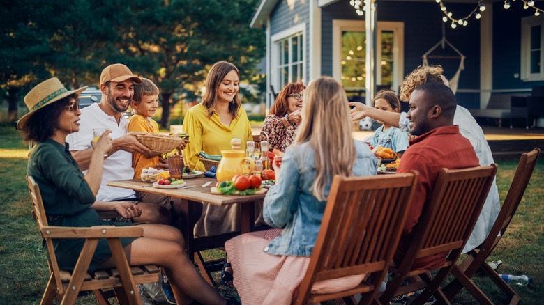 passing food at dinner party
