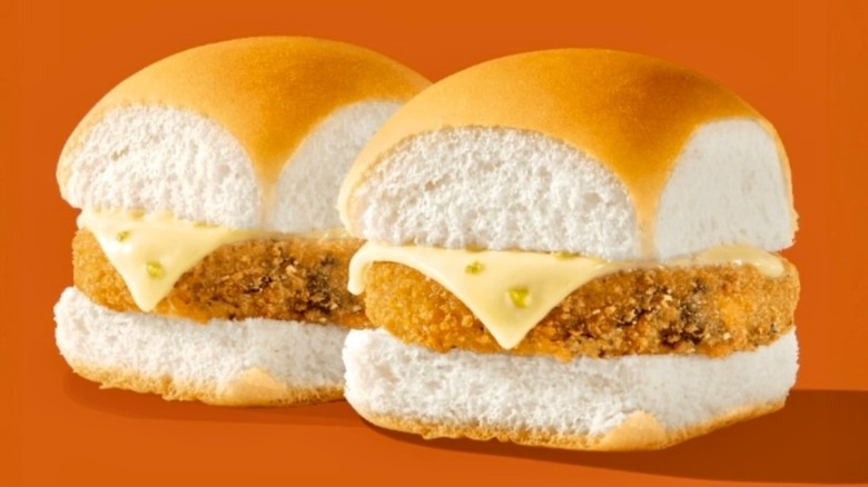Two White Castle Southwest Veggie Sliders against an orange background