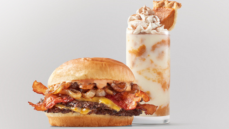 A ﻿Freddy's Frozen Custard & Steakburgers Smoky Bacon Cheddar Stack sits next to a Pumpkin Pie Concrete