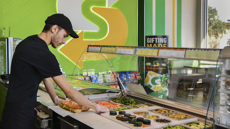 Subway sandwich employee builds a 12 inch sandwich