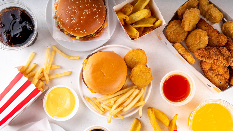 Fast food items arranged on a background.