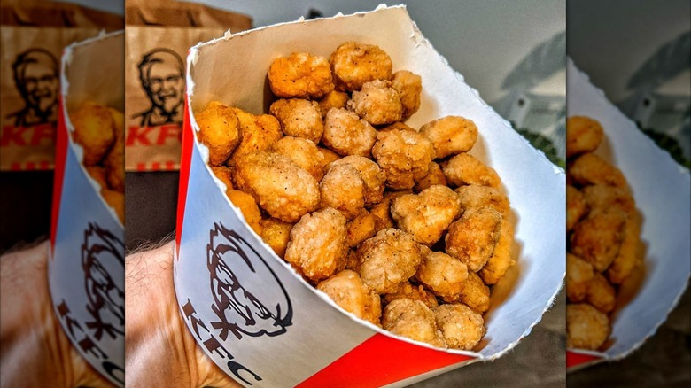 Closeup of KFC popcorn chicken bucket.