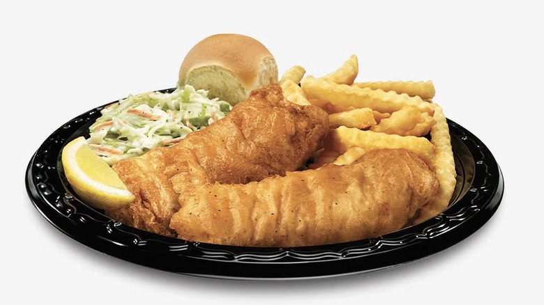 A plate with fried cod, French fries, slaw, and a roll from Culver's
