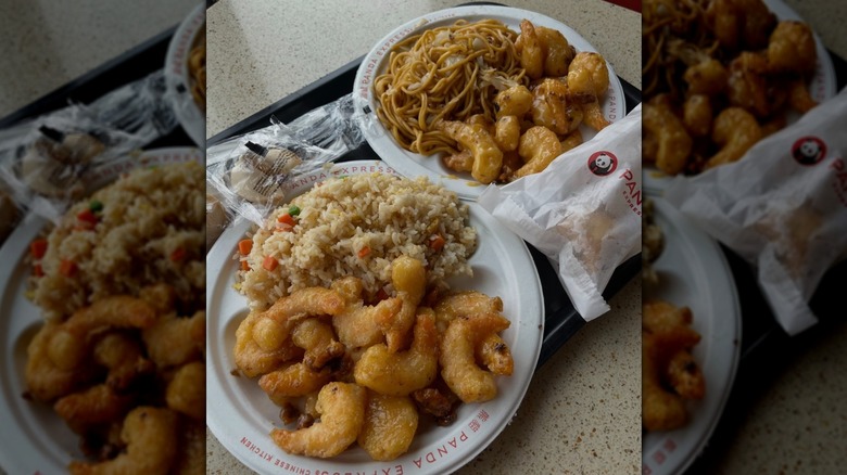 Plates of Panda Express Honey Walnut Shrimp with rice and noodles