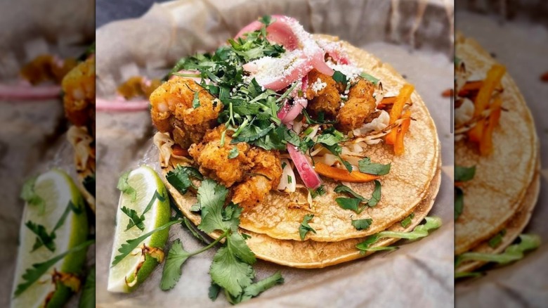 Fried Baja Shrimp Taco from Torchy's featuring pickled onions and cilantro