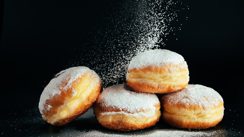 sufganiyot on black background