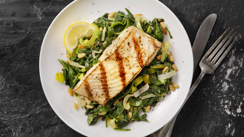 grilled halibut on a white plate