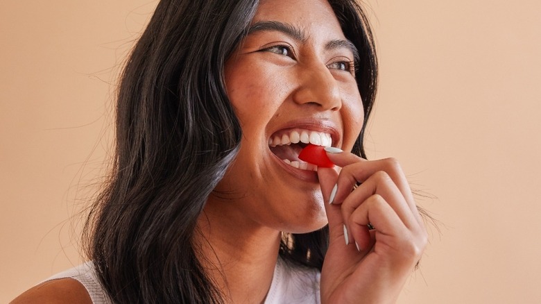 Woman eating gumdrop