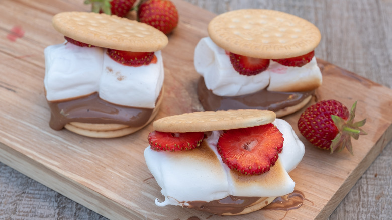 Strawberry s'mores on wood board