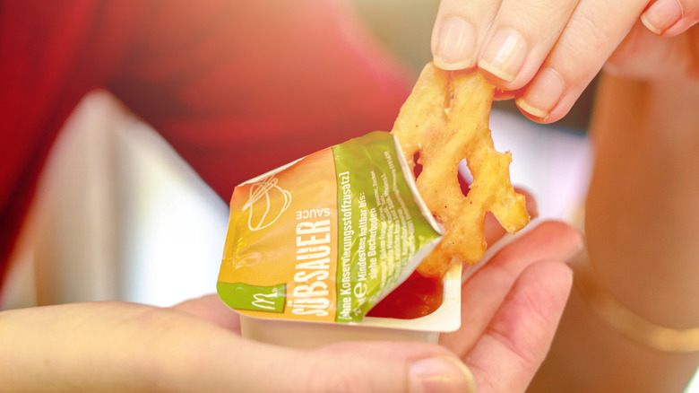 Person eating McDonald's sweet and sour sauce.