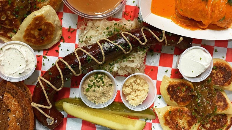 A variety of Polish foods sit on a checkered place mat