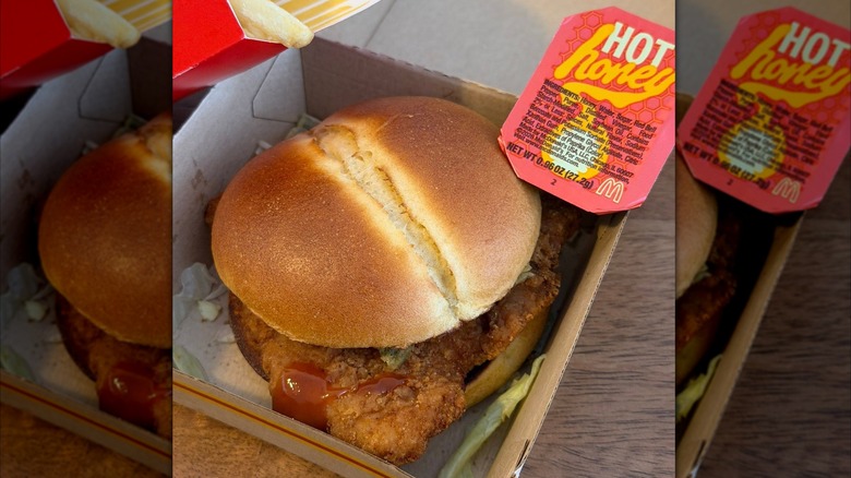 A Hot Honey McCrispy sandwich with a side of hot honey from McDonald's
