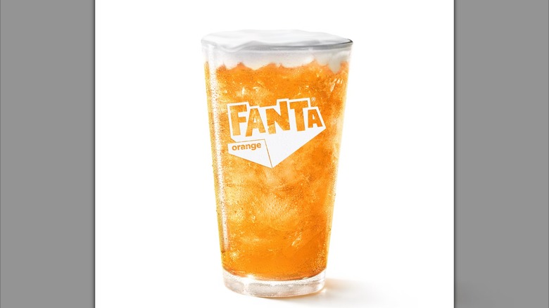 A cup filled with Orange Dream with Fanta from McDonald's