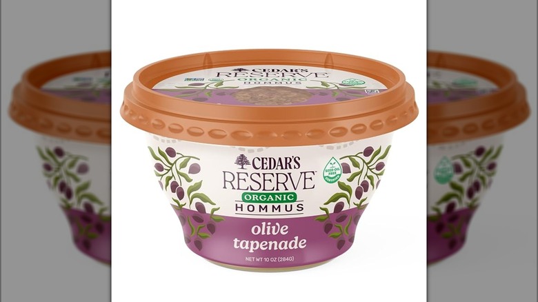 A container of Cedar's Organic Olive Tapenade Hummus pictured.
