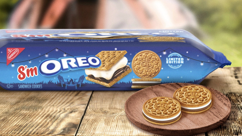 Package of S'mOREO Sandwich Cookies next to cookies on a plate.