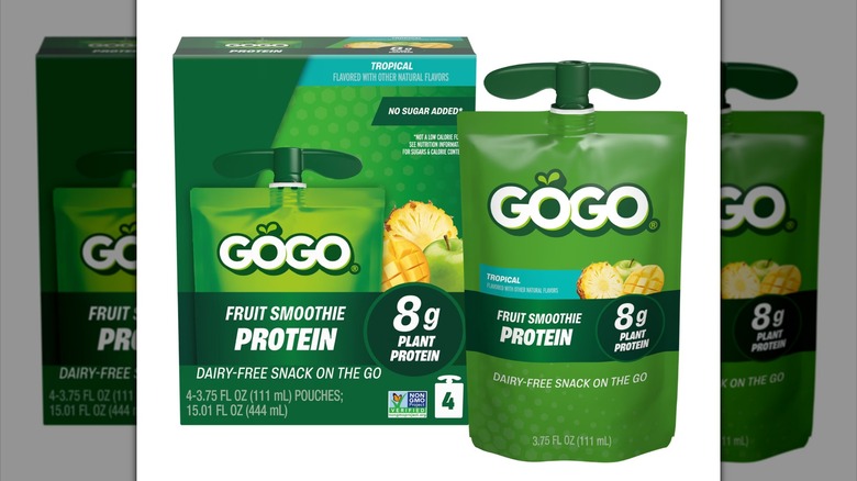 A GOGO Fruit Smoothie Protein Tropical pouch sits next to the product box.