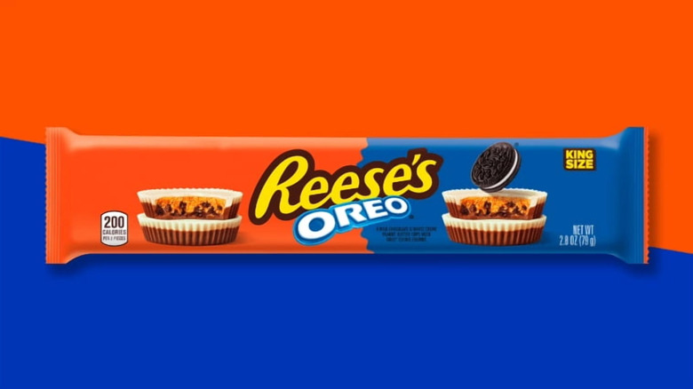 A package of king-size Reese's Oreo cups against an orange and blue background