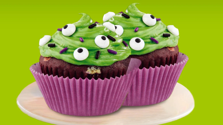 Green-frosted cupcakes with eyeball sprinkles
