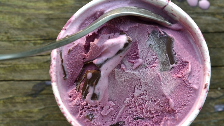 carton of melting fruity ice cream